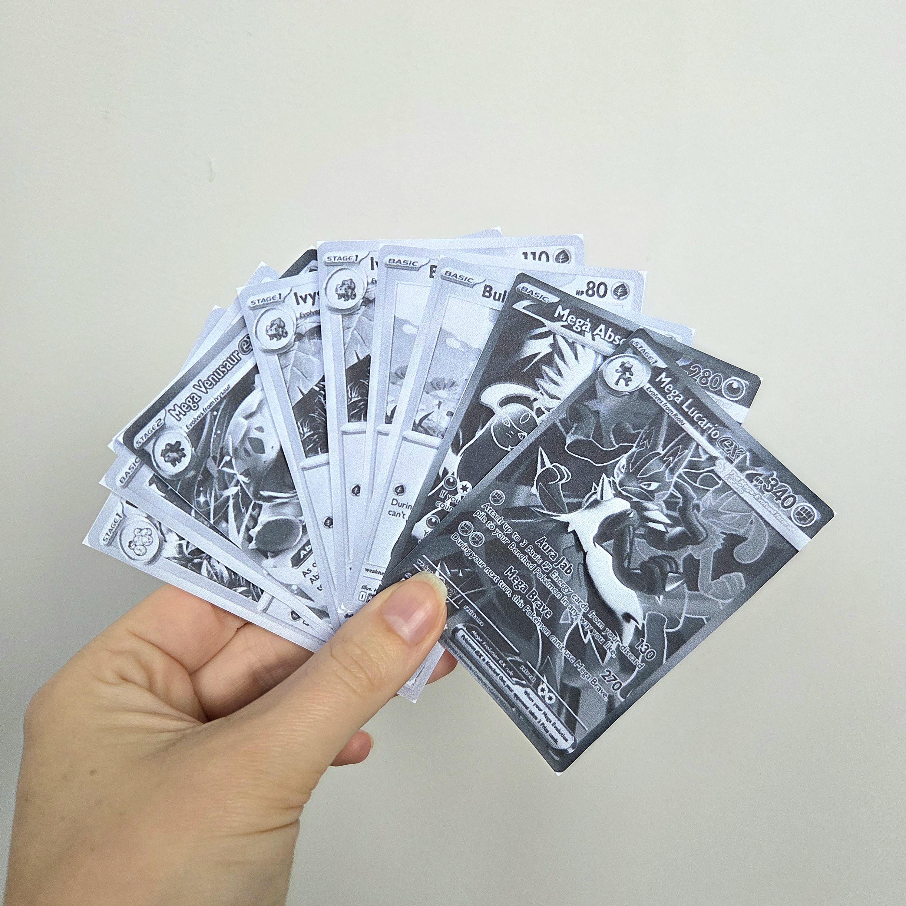 Mega Evolution grayscale cards example showing Pokémon cards used to demonstrate how the master set fits into a collector’s binder.